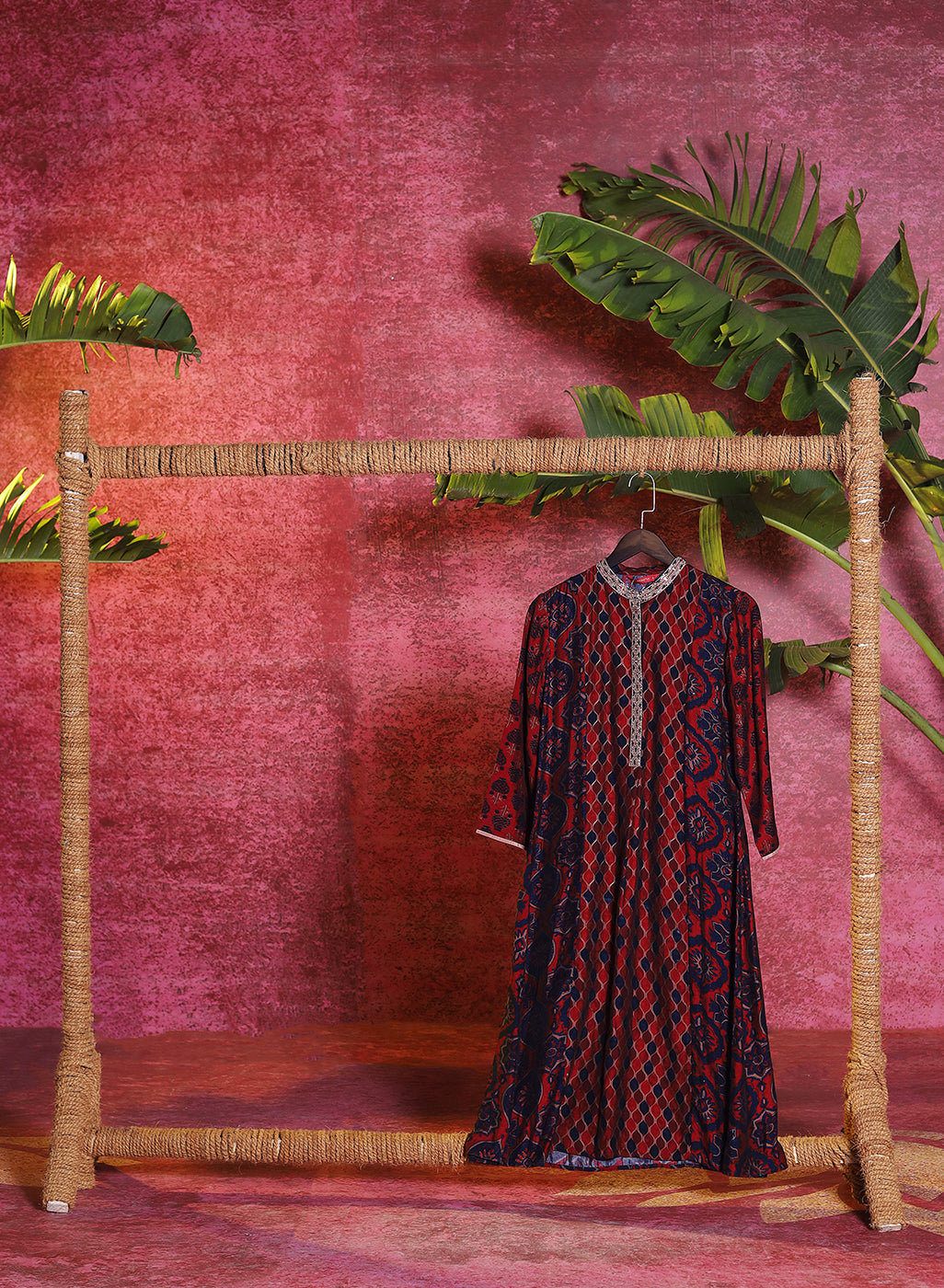 Front view of a hanging Taara Maroon Printed Viscose Silk Indo-Western Dress