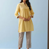 Yellow Embroidered Thigh Length Crinkled Kurti - Lakshita