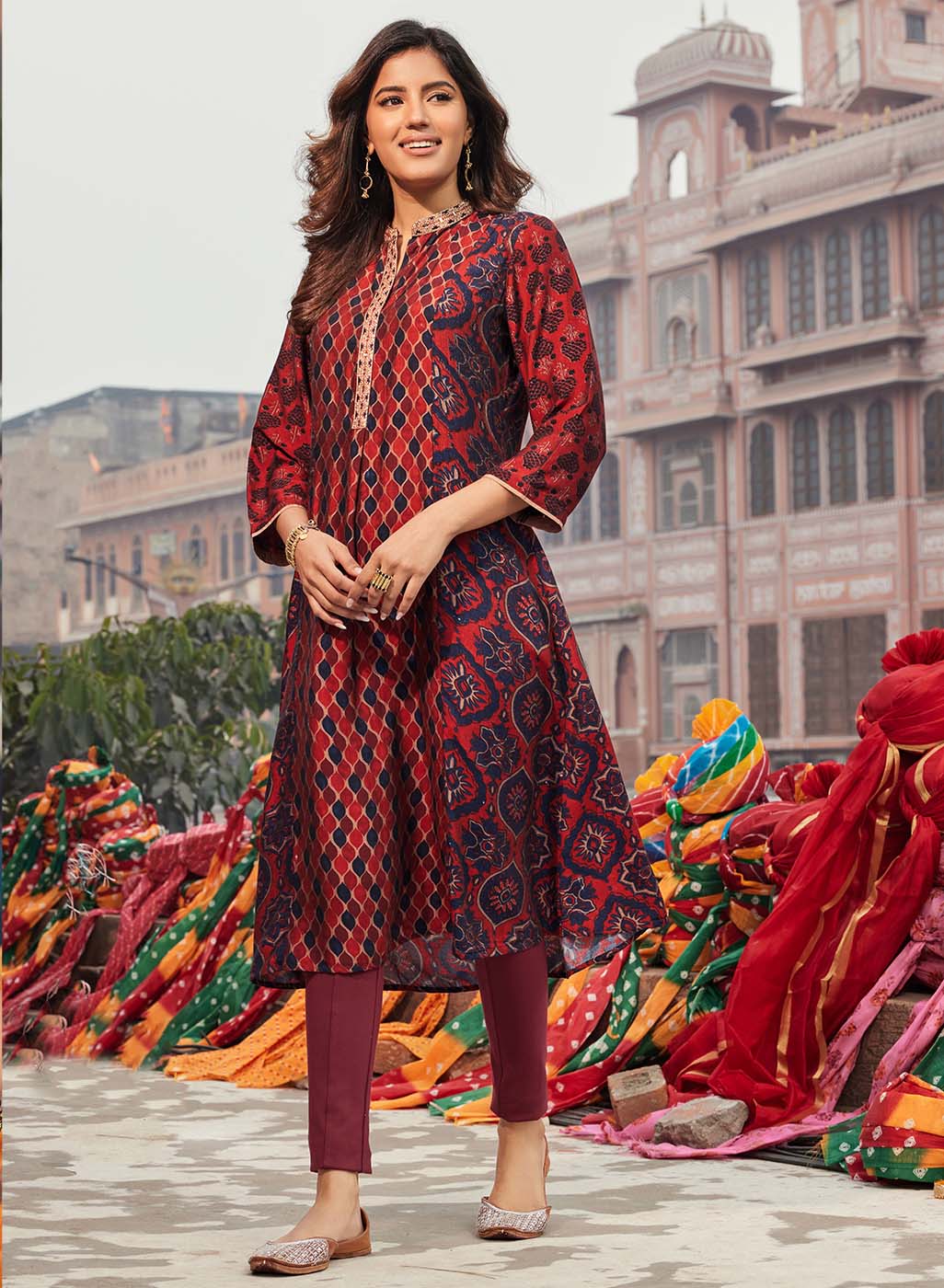 Woman wearing Taara Maroon Printed Viscose Silk Indo-Western Dress with floral print and vibrant hues