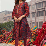 Woman wearing Taara Maroon Printed Viscose Silk Indo-Western Dress with floral print and vibrant hues