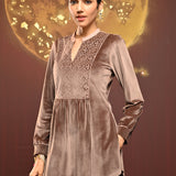 Woman showing move in Qainaat Beige Embroidered Velvet Top