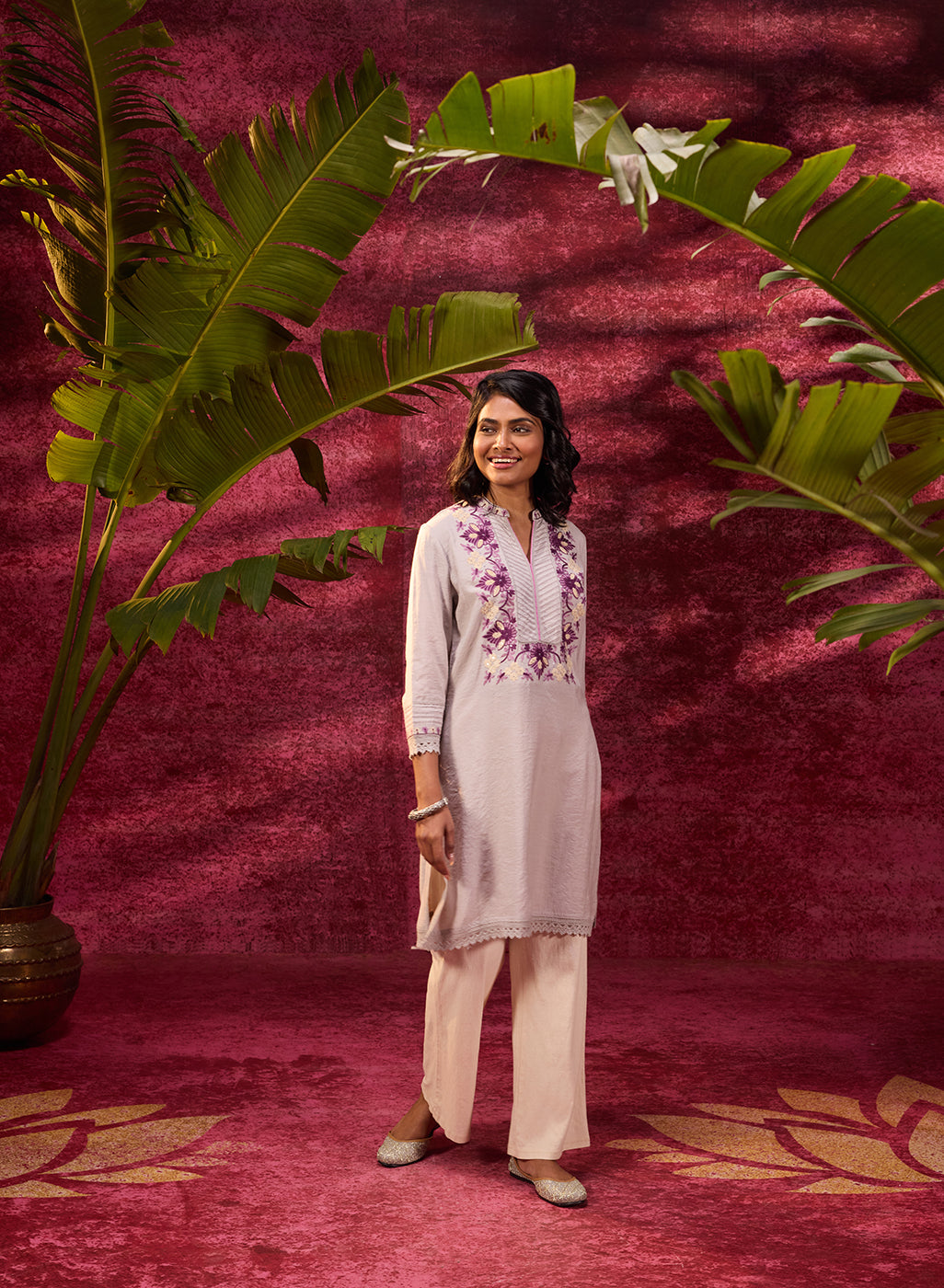 Woman smiling in Gulbahar Mushroom Grey Embroidered Kurta