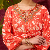 Thready embroidery on the neck of orange rayon printed kurta set for women