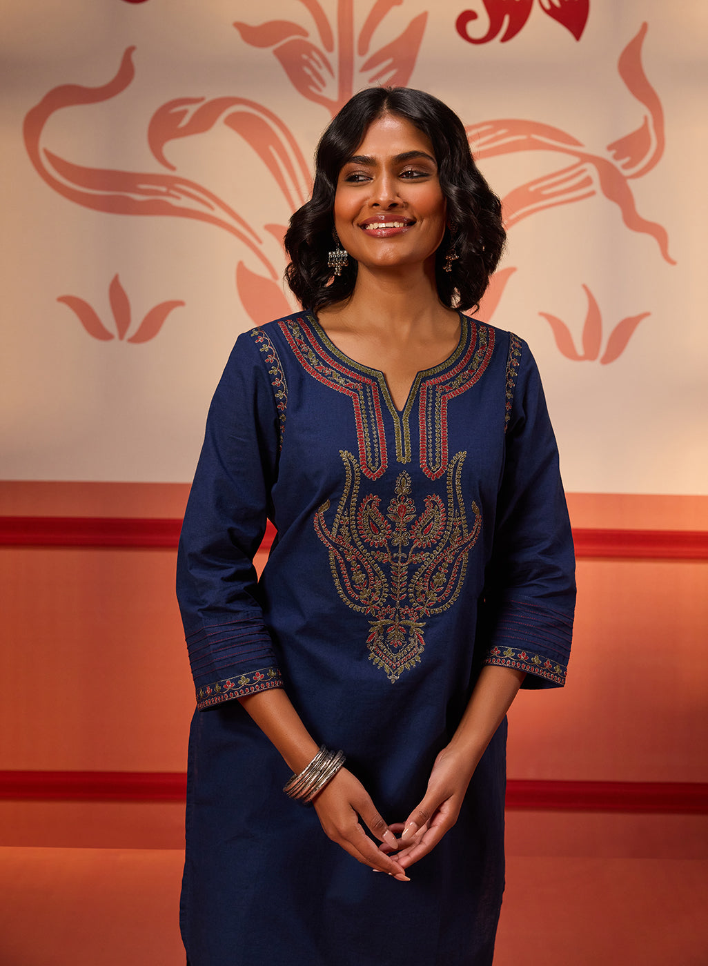 Woman smiling in Khurshid Navy Blue Embroidered Cotton Linen Designer Kurta
