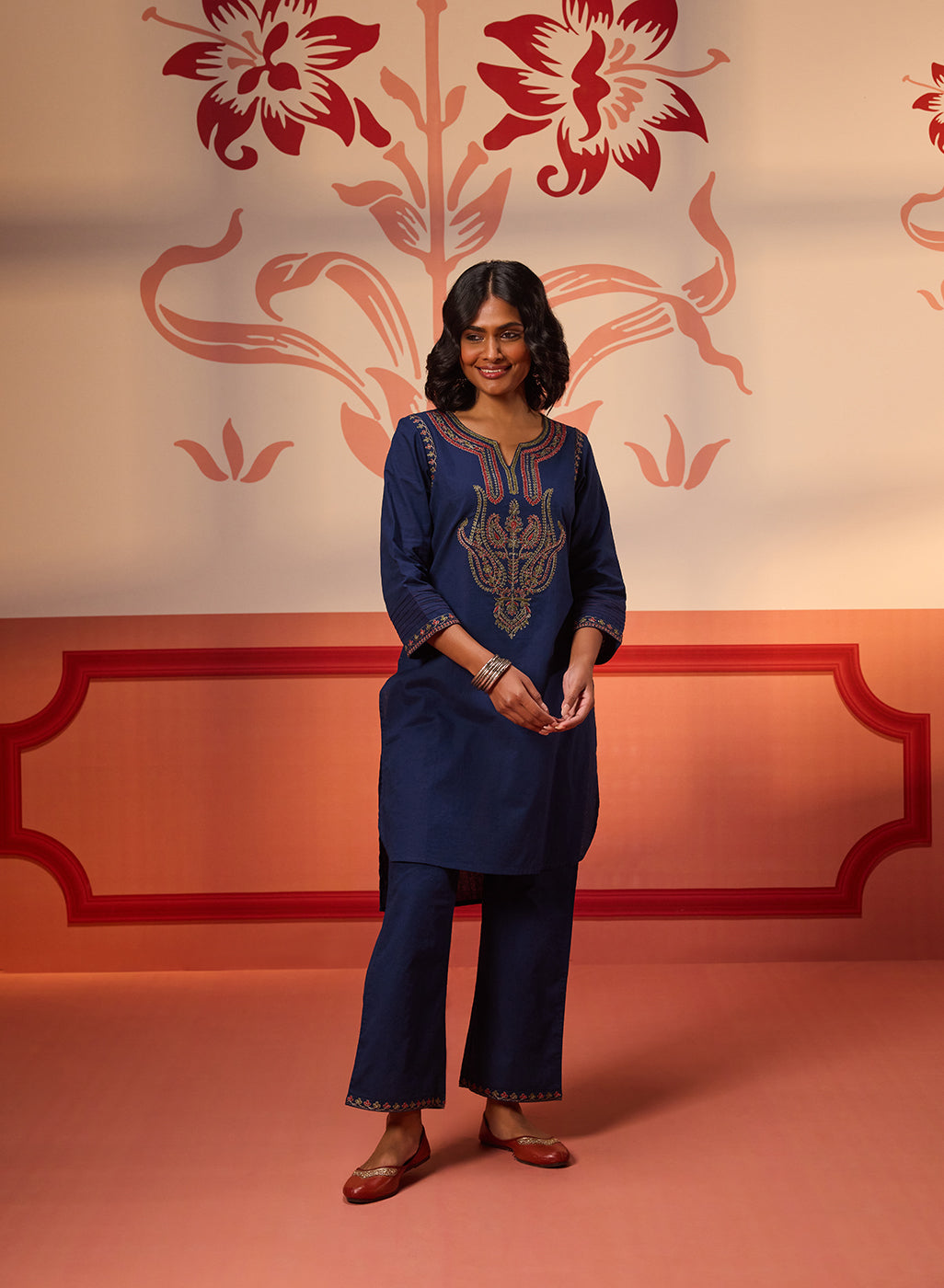 A woman wearing Khurshid Navy Blue Embroidered Cotton Linen Designer Kurta Set