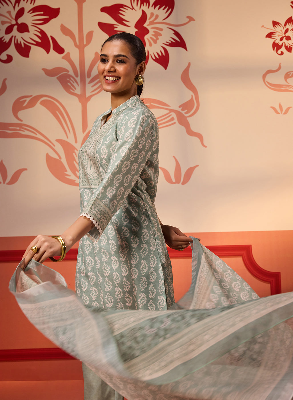 Woman in joy while swaying in Fiona Aqua Printed Cotton Linen Set with Dupatta