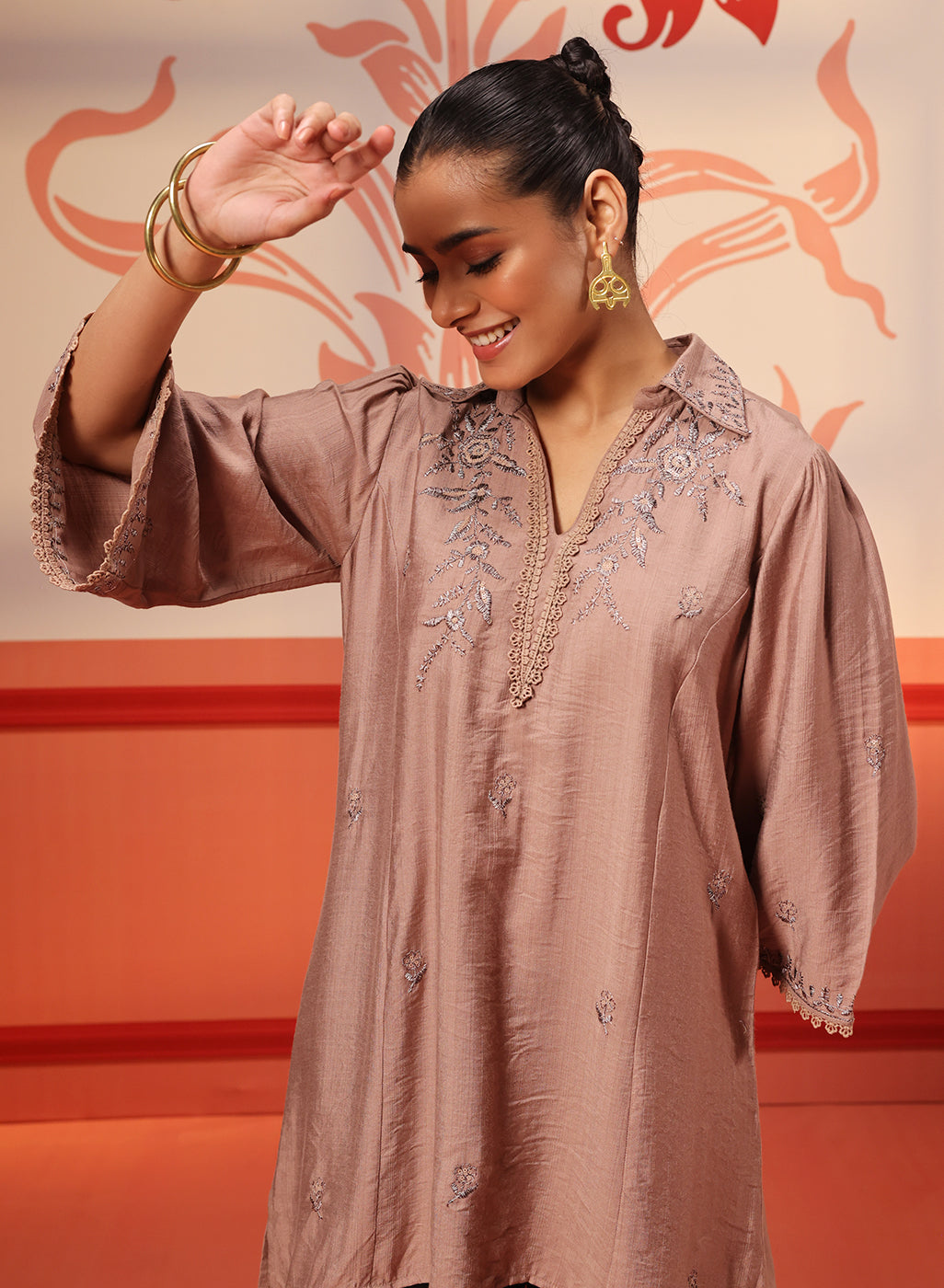 A woman wearing a Niya Oak Brown Embroidered Cotton Linen Slub Long Top