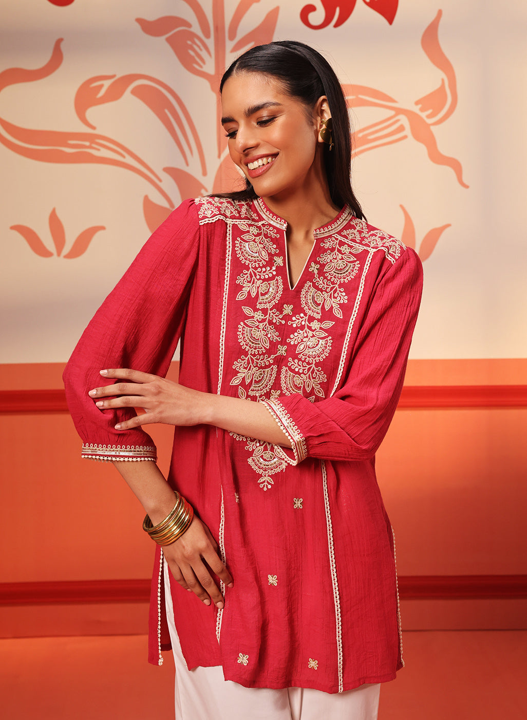 Woman swirling in a Kashaf Crimson Pink Embroidered Crinkled Crepe Long Top