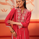 Woman swirling in a Kashaf Crimson Pink Embroidered Crinkled Crepe Long Top