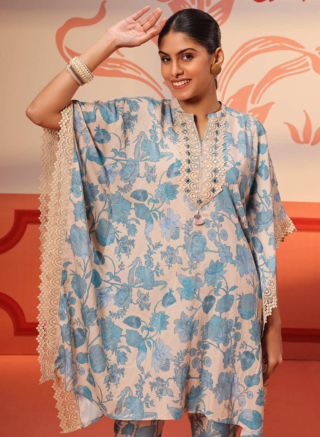 Woman showing the sleeve style of Mahin Smokey Blue Printed Kaftan Kurta Set