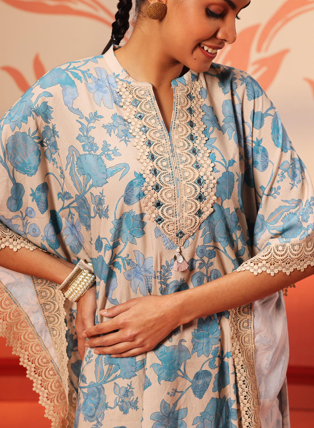 Close-up view of the neckline and sleeves work of Mahin Smokey Blue Printed Kaftan Kurta Set