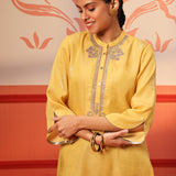 Woman smiling in Rumi Bright Yellow Printed Tunic