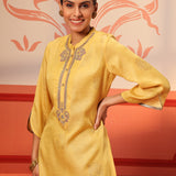 Woman posing in Rumi Bright Yellow Printed Tunic Set