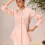 Woman in a Nudrat Light Pink Embroidered Cotton Long Shirt