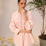 Woman posing in a Nudrat Light Pink Embroidered Cotton Long Shirt