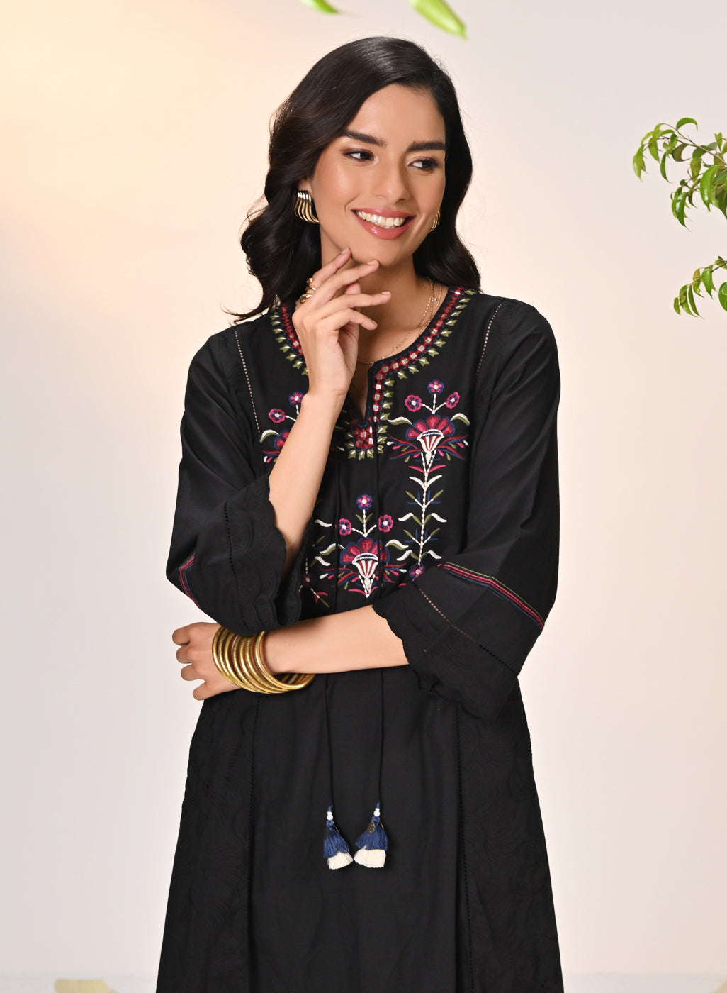 Woman smiling in Harleen Ivory with Black Embroidered Cotton Linen Kurta