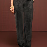 Woman showcasing the bottomwear of the Mumtaaz Grey Embroidered Velvet Co-ord Set