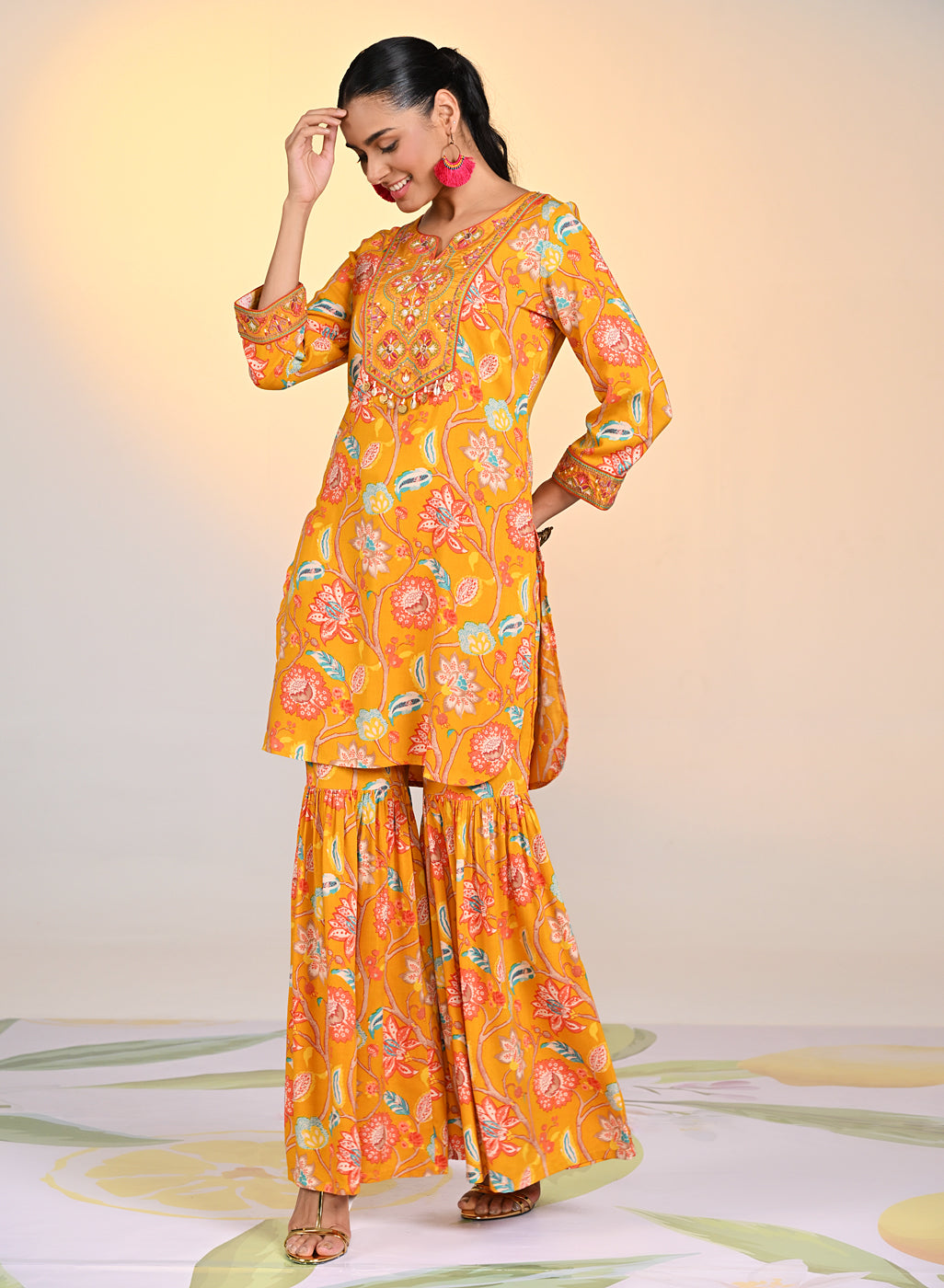 Woman swirling in a Yellow Zoya Punch Printed Co-ord Set