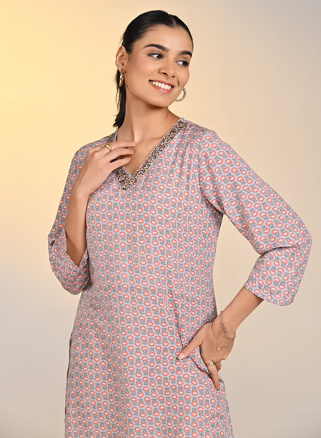 Woman smiling wearing Nadia Light Grey Printed V-Neck Kurta