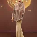 Woman posing sideways in Qainaat Beige Embroidered Velvet Top