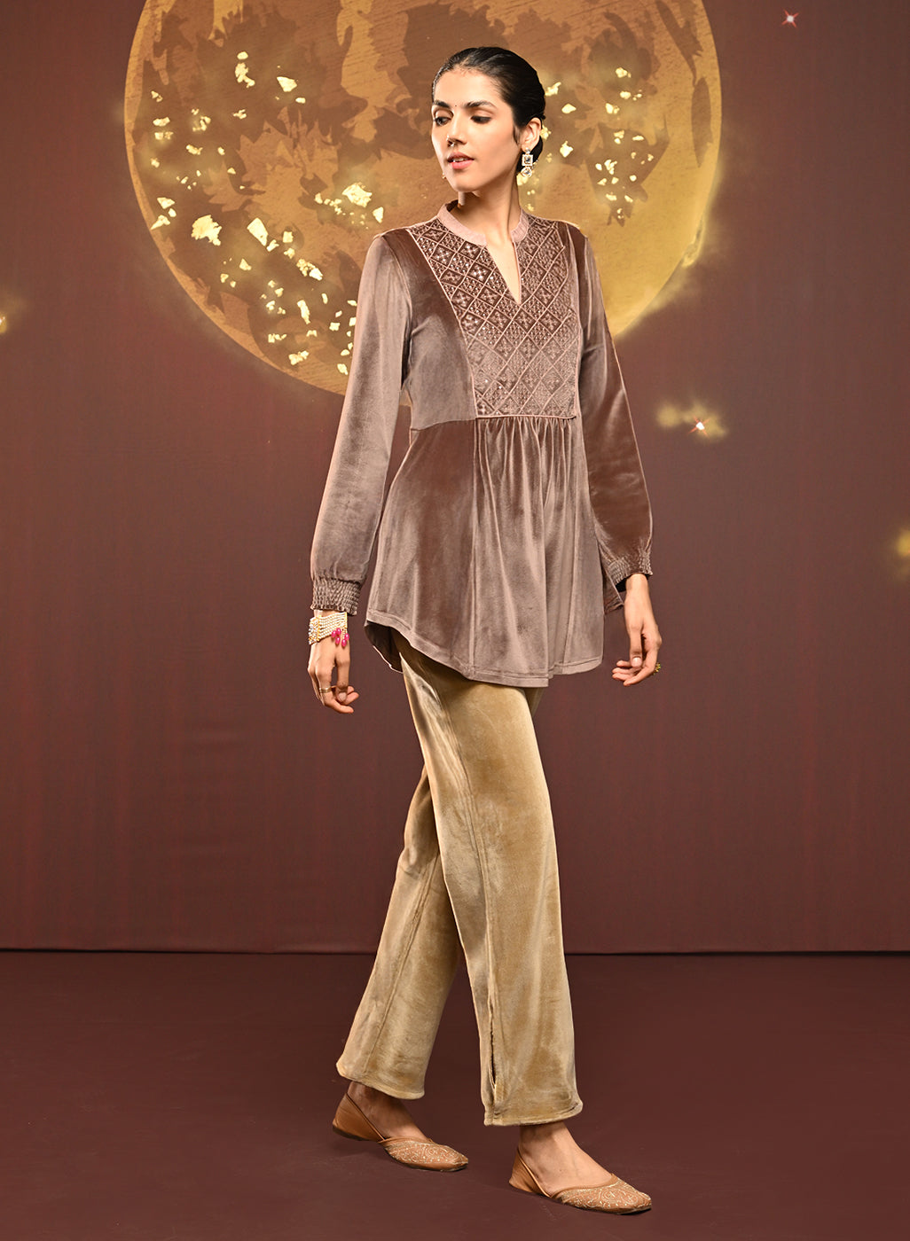 Woman posing sideways in Qainaat Beige Embroidered Velvet Top