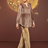 Woman posing sideways in Qainaat Beige Embroidered Velvet Top