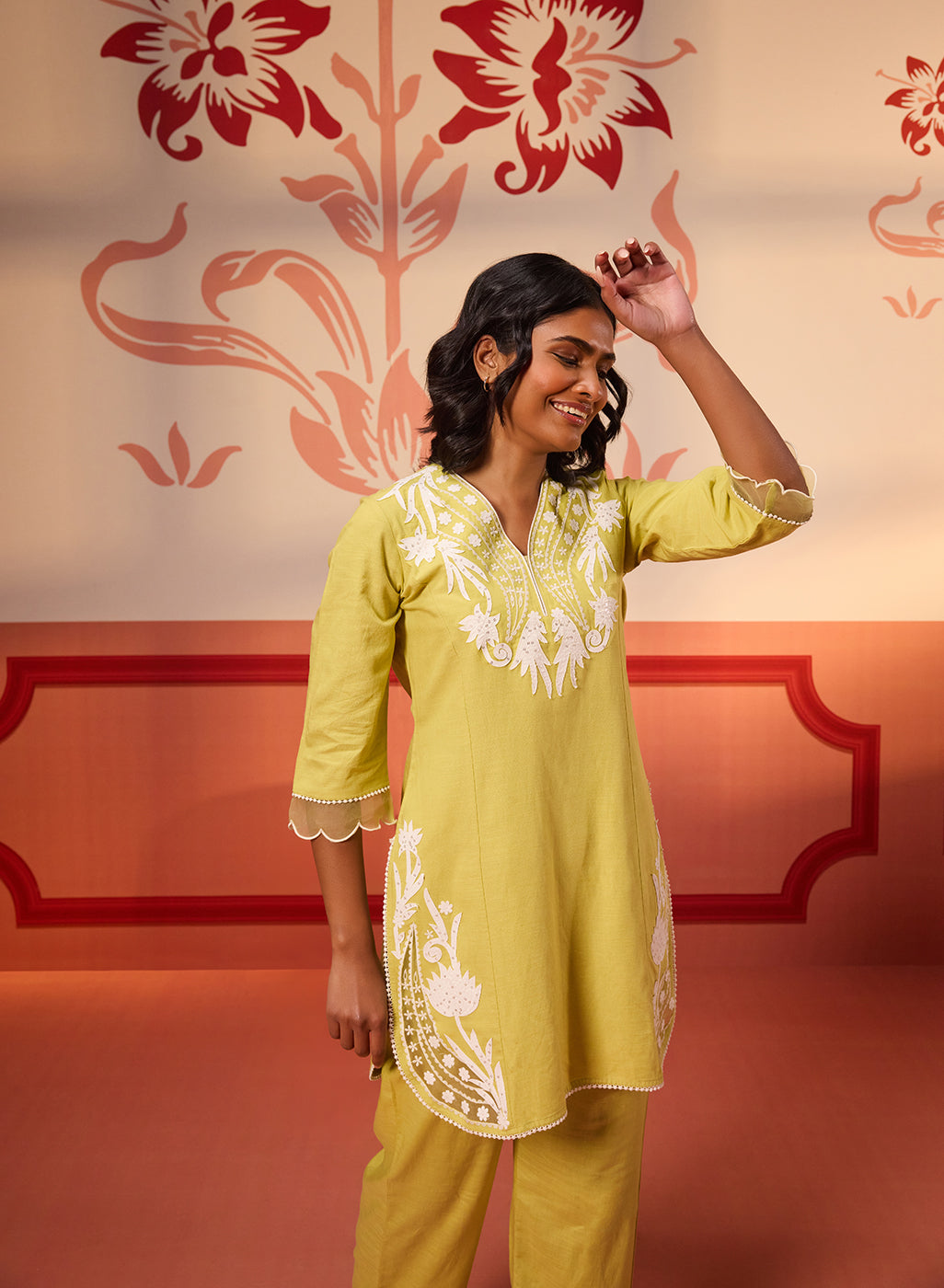 Woman flaunting Shehwar Salmon Apple Green Embroidered Cotton Linen Co-Ord Set's top