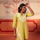 Woman flaunting Shehwar Salmon Apple Green Embroidered Cotton Linen Co-Ord Set's top