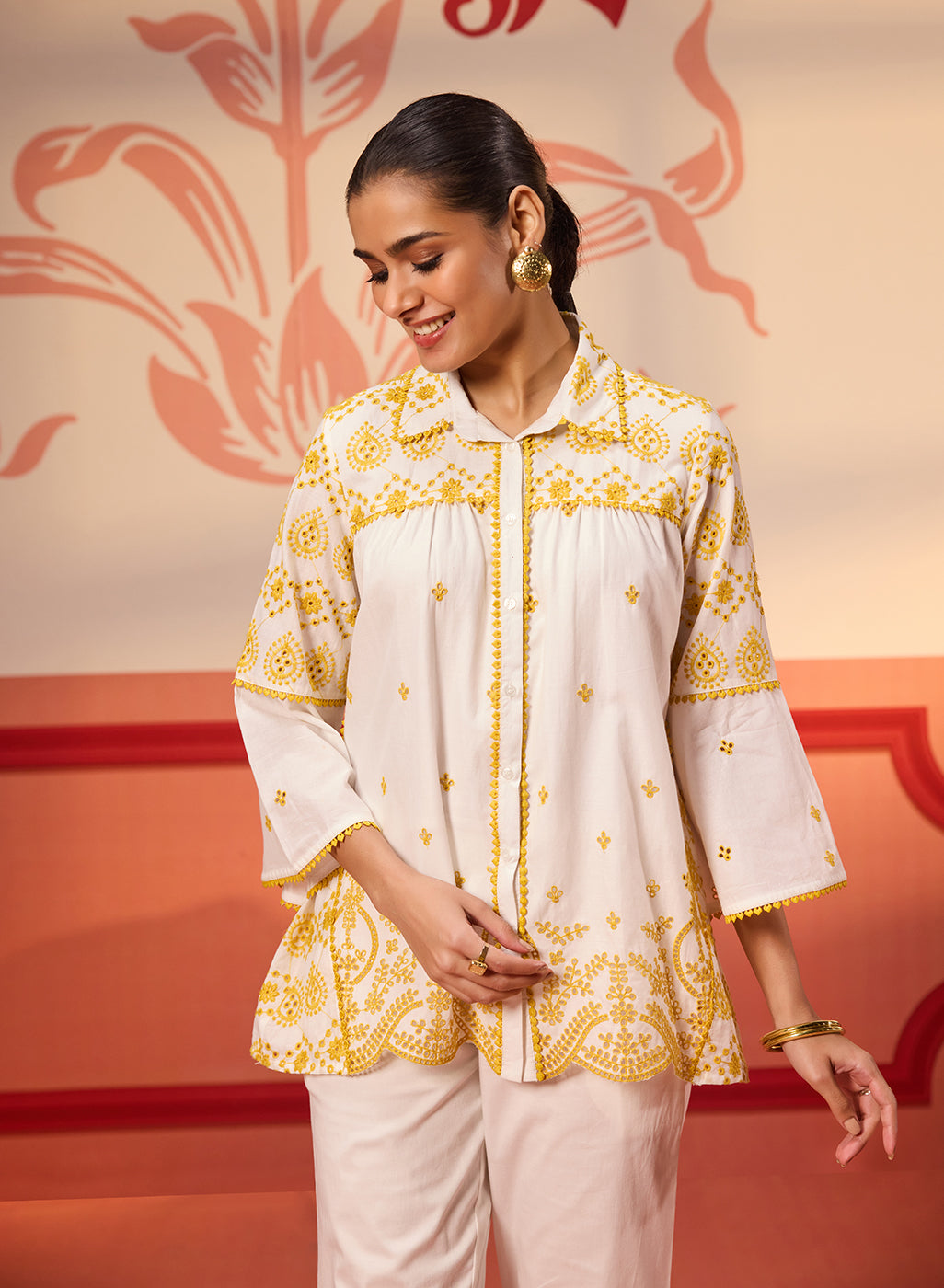 Woman smiling in Masakali Ivory with a Yellow Embroidered Schiffli Shirt