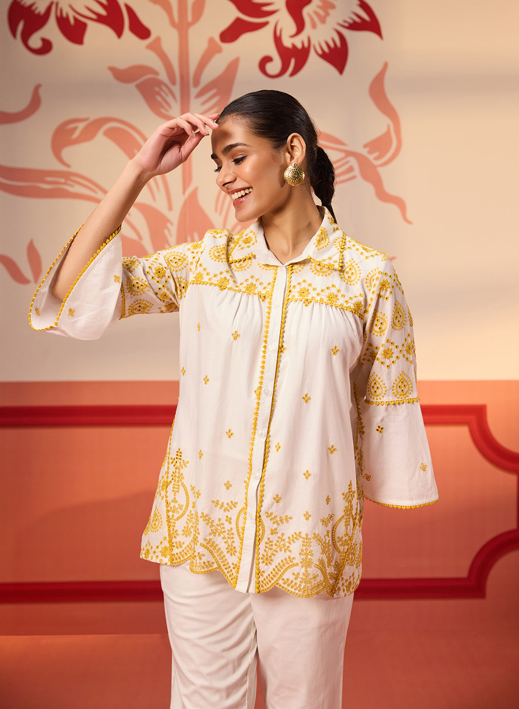 Woman posing in Masakali Ivory with a Yellow Embroidered Schiffli Shirt