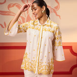 Woman posing in Masakali Ivory with a Yellow Embroidered Schiffli Shirt