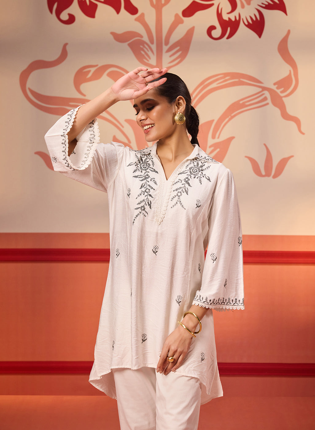 Niya Ivory Embroidered Cotton Linen Slub Long Top paired with a white Hakoba pants