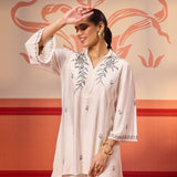 Niya Ivory Embroidered Cotton Linen Slub Long Top paired with a white Hakoba pants