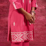 Close-up view of the intricate hem work of Nayaab Watermelon Pink Embroidered Cotton Kurta Set