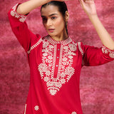 Close-up front view of a Saadgi Red Embroidered Cotton Linen Tunic