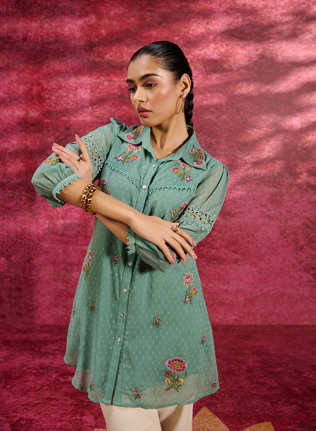 Woman wearing Breeze Sea Green Embroidered Georgette Shirt with golden jewellery
