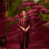 A woman wearing Taara Maroon Printed Viscose Silk Indo-Western Dress