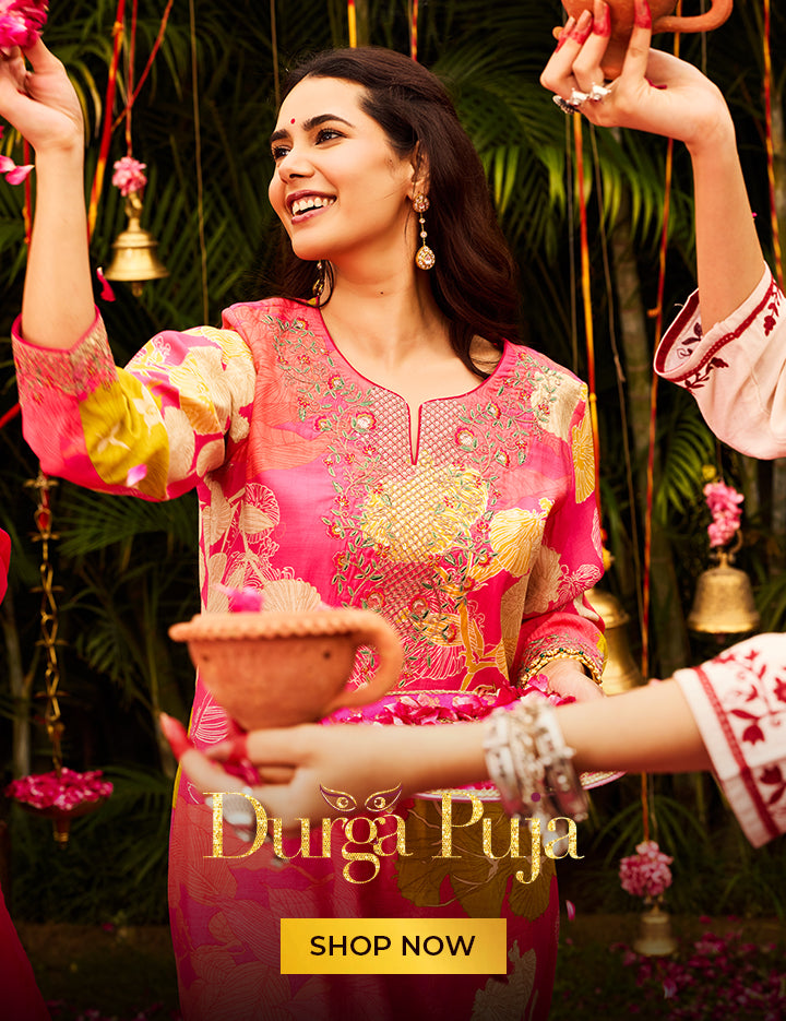 Woman wearing a pink colour printed kurti for Durga Puja