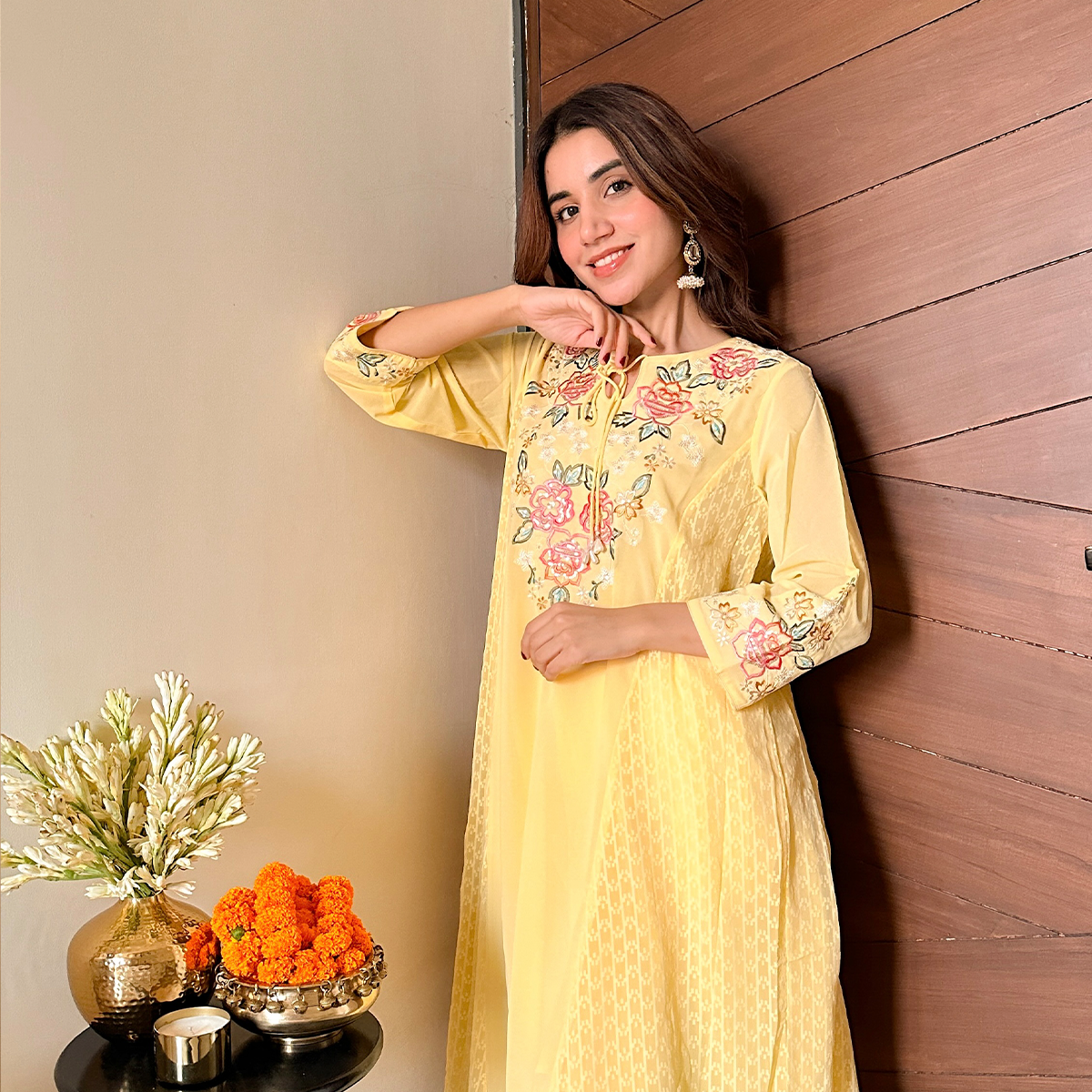 Muskaan Makol Wearing a Long Yellow Kurti with Floral Prints in Neck and Sleeves