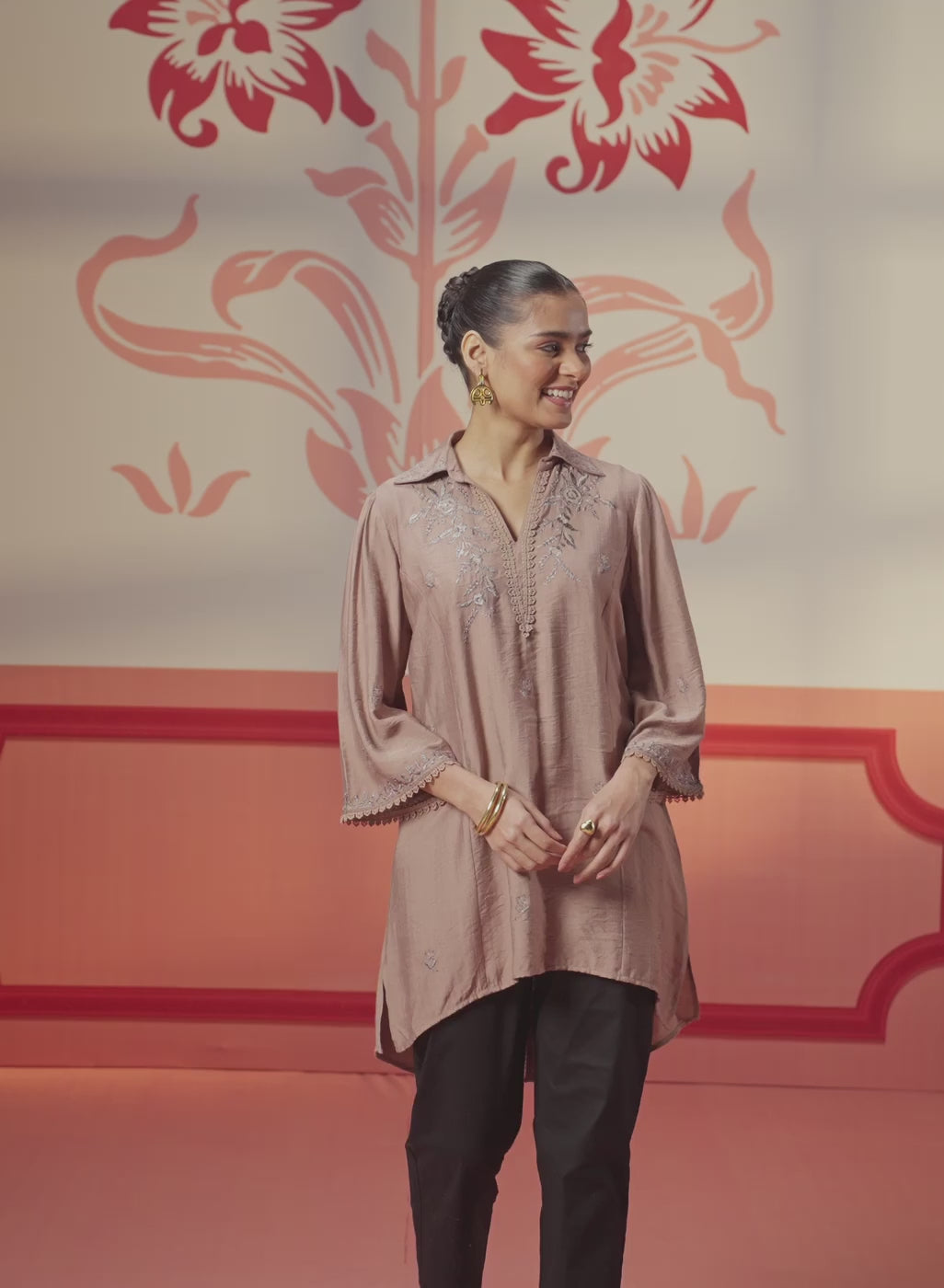 A woman wearing a Niya Oak Brown Embroidered Cotton Linen Slub Long Top with Intricate Patterns