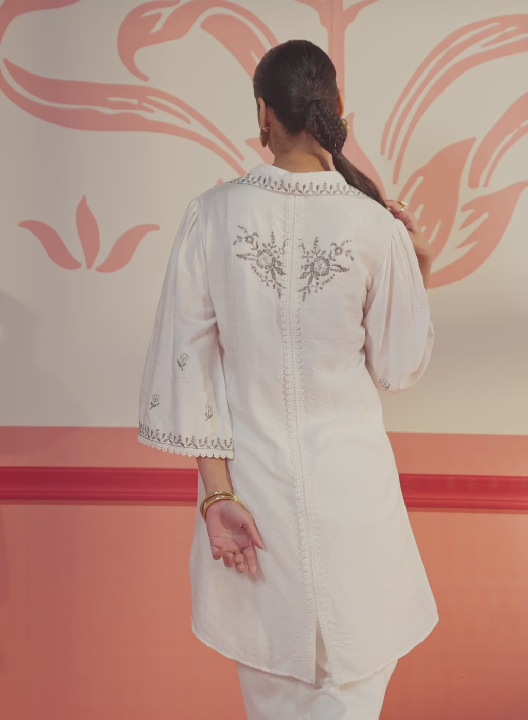 Close up view of Niya Ivory Embroidered Cotton Linen Slub Long Top with V neck