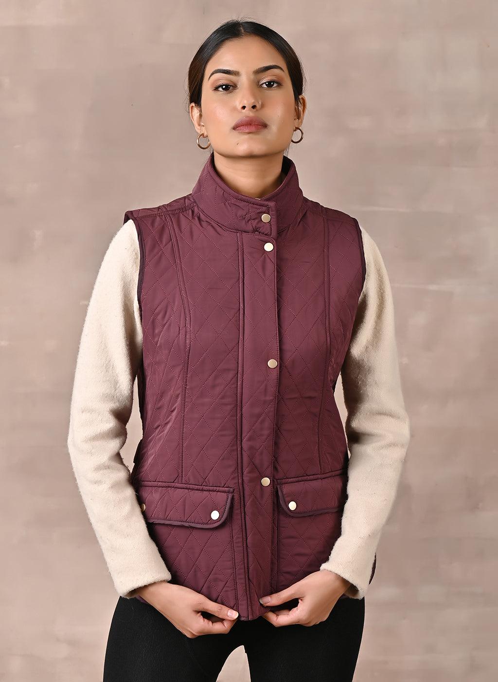 Maroon Solid Sleeveless Quilted Jacket With Rivets Detail & Curved Hem - Lakshita